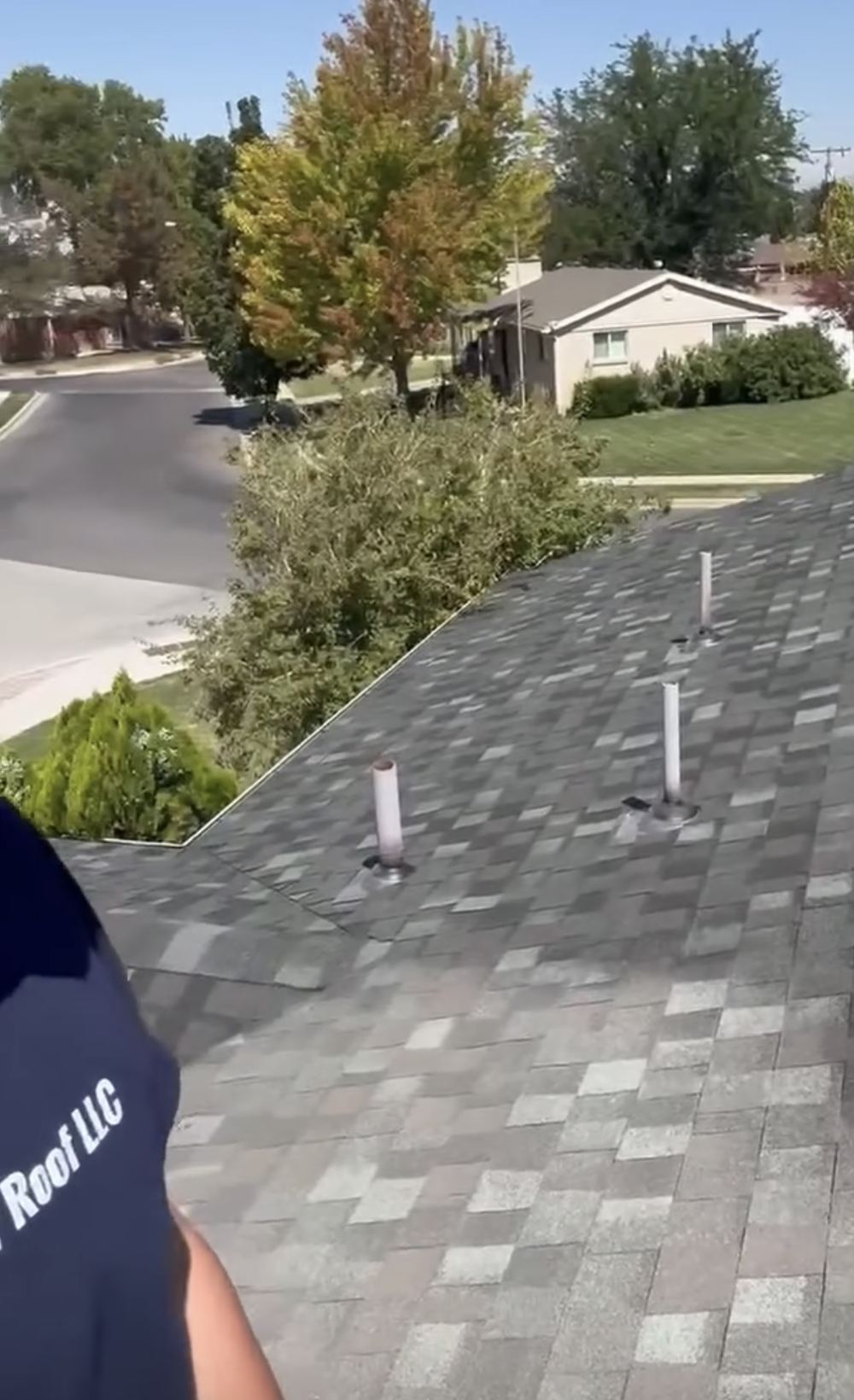 Revive Your Roof crew member on a shingle roof in Utah