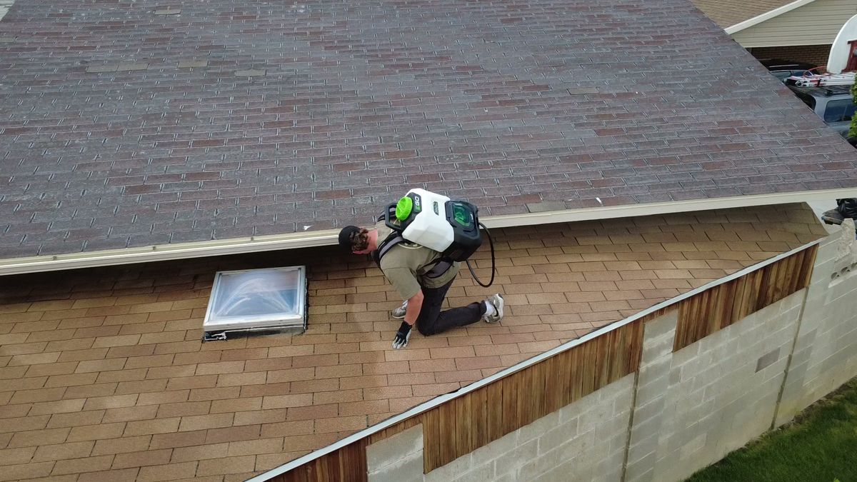 Revive Your Roof technician working on detail repairs around a skylight on a Utah roof