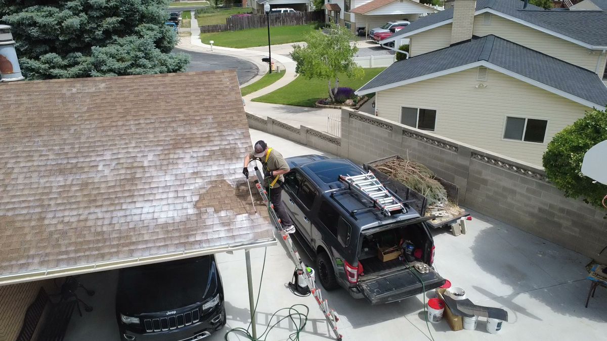 The Revive Your Roof van and ladder arriving at a Utah home for a free inspection