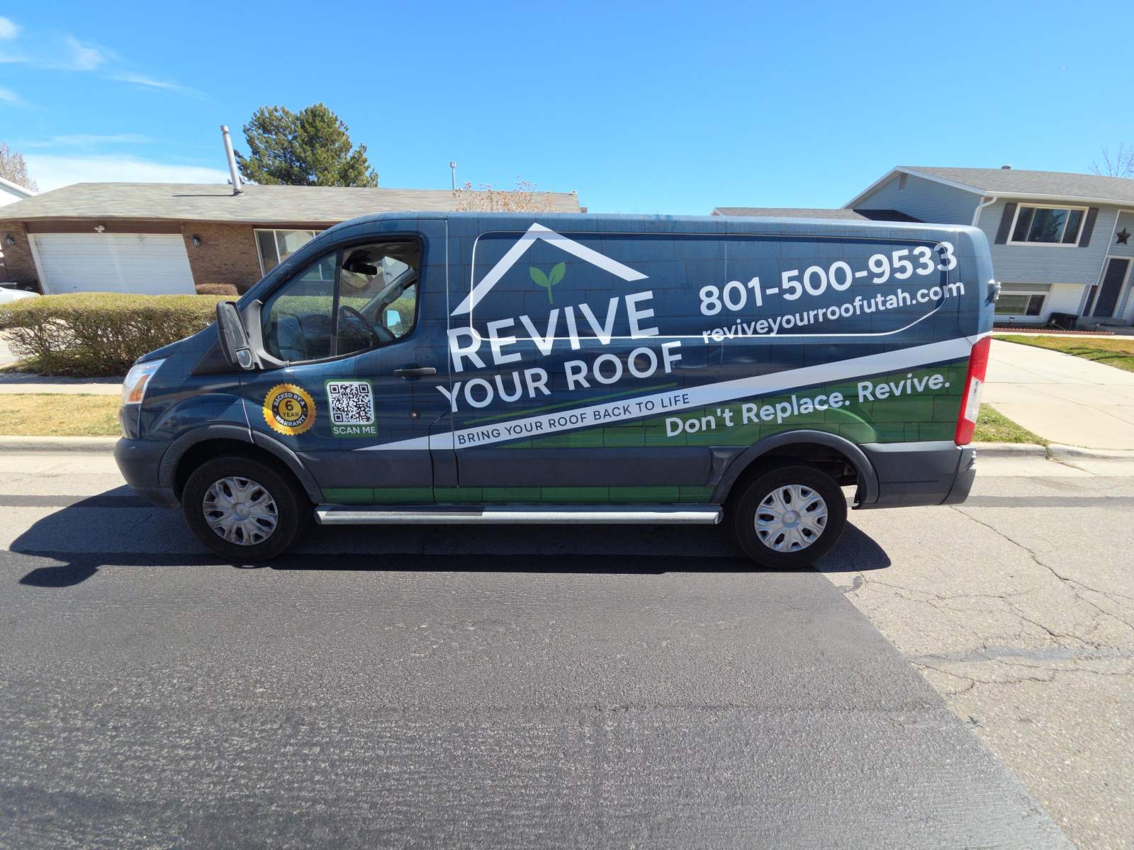 Revive Your Roof van parked on a residential street in Utah